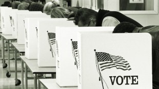 Photo showing voters cast their ballots on Election Day November 04, 2008, at Centreville High School in Clifton, Virginia. Americans crowded polling stations Tuesday to vote in their historic election, with front-running Democrat Barack Obama seeking to become the first black US president and Republican rival John McCain battling for a comeback.  AFP Photo/Paul J. Richards (Photo credit should read PAUL J. RICHARDS/AFP via Getty Images)