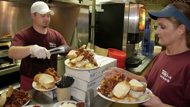 Workers prepare and serve food at a restaurant in Birch Run, Michigan. (Jeffrey Greenberg/Universal Images Group via Getty Images)